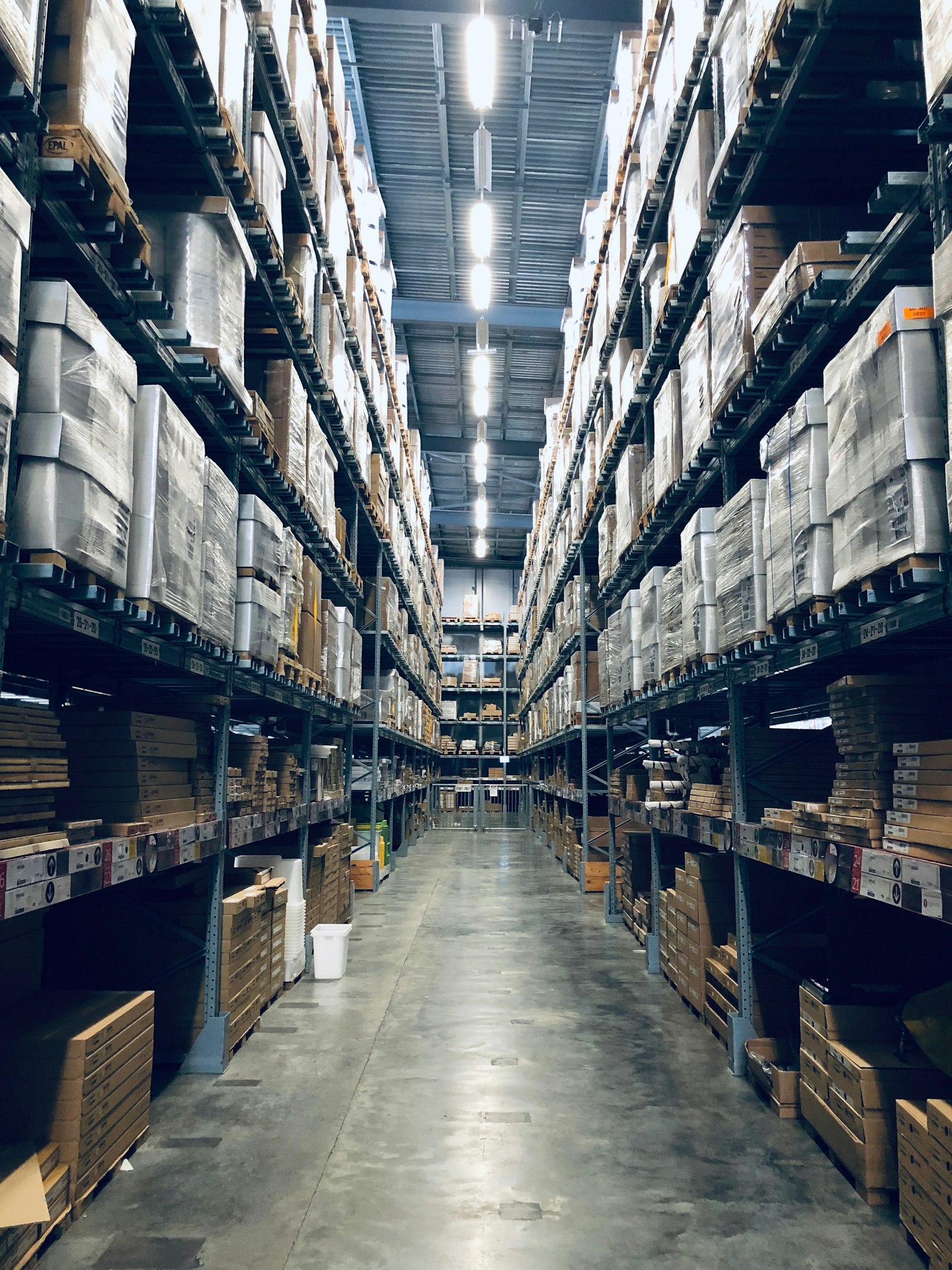 4K security cameras monitoring a warehouse interior with product aisles